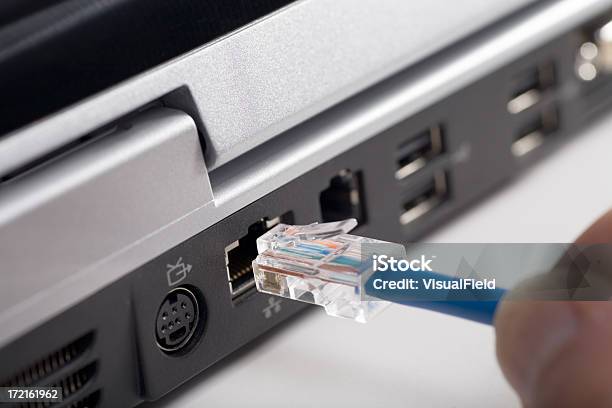Fingers Plugging Usb Cable Into Back Of Laptop Stock Photo - Download Image Now - Network Connection Plug, Cable, Internet