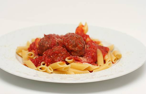 Spaghetti and meatballs isolated on white background.