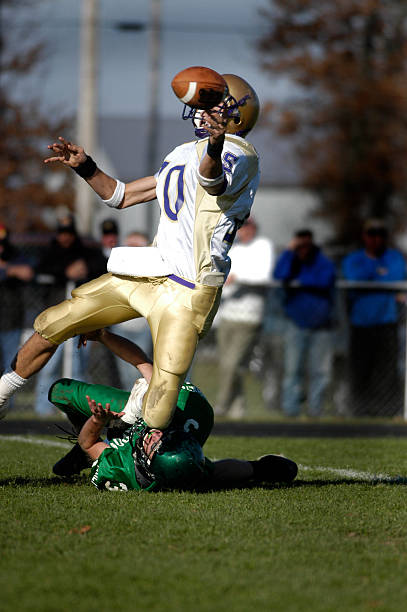 American Football player about to catch a football A dropped pass in an american High School Football game. Touchdown stock pictures, royalty-free photos & images