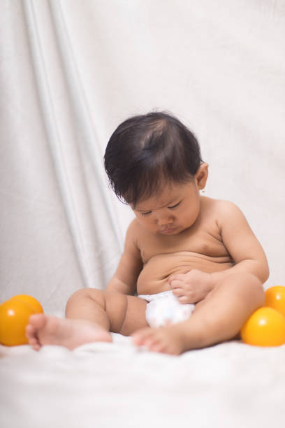 Portrait of a baby with many face expression - Stock Photo
