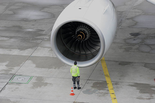 Big one Man looking into jet engine jet intake stock pictures, royalty-free photos & images