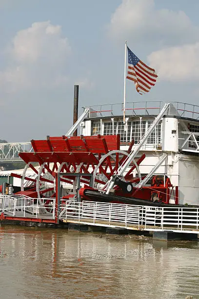 "Paddlewheel on a Sternwheeler. Paddleboat. Steamboat. On the Ohio River in Cincinnati, Ohio. Includes an American Flag."