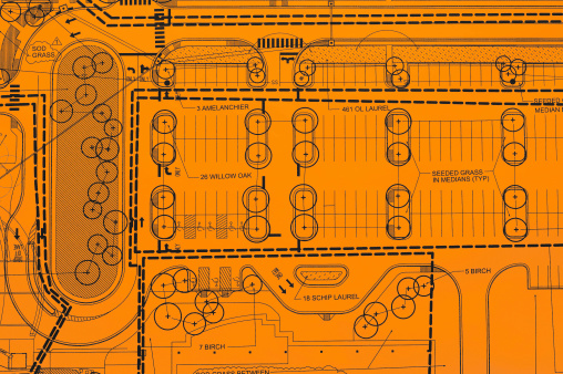 Parking lot blueprint on orange paper.