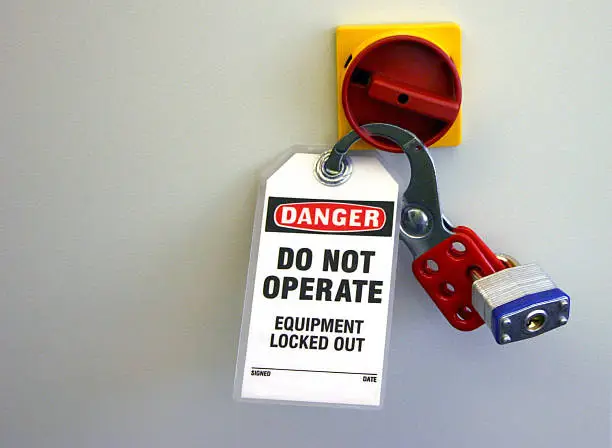Photo of Locked equipment with locks and danger sign notice
