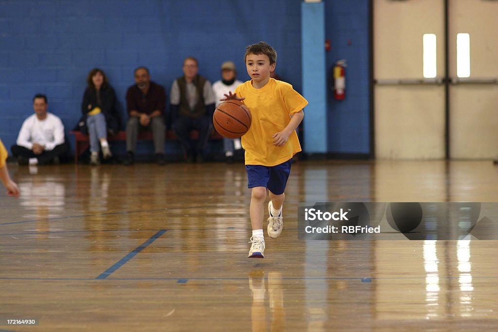 Basketball a boy dribbling a basketball Basketball - Sport Stock Photo