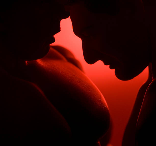 Lovers (Action figures.) Silhouette of male lovers in sensitive embrace.You may also be interested in: gay men kissing men silhouette stock pictures, royalty-free photos & images