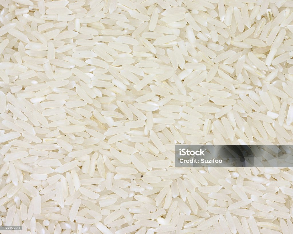 white rice "White rice, which is rice which has been stripped of the husk, the bran, and part of the germ. It is not a whole grain, but is more tender and cooks faster than brown rice." Long Grain Rice Stock Photo