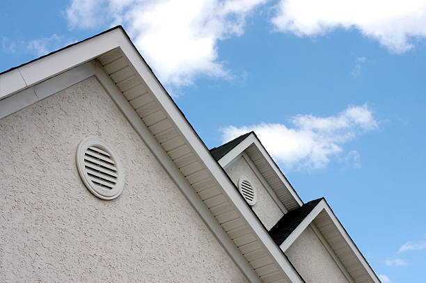 Close up of roof peaks against blue sky adjacent peaks on a house eaves stock pictures, royalty-free photos & images