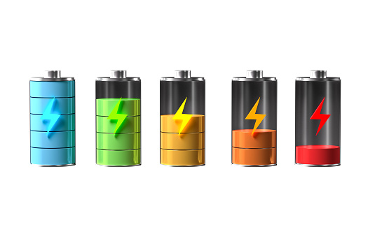 Battery recycling concept. Orange eco battery with black batteries on dark background