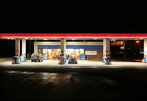 a shot of an all night garage taken at night with freeway in the background