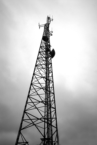 black and white image of a communications mast, gritty contrast intentional