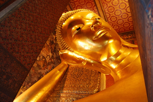 This Buddha is 46 m long and 15 m highand is located in Wat Pho Bangkok.