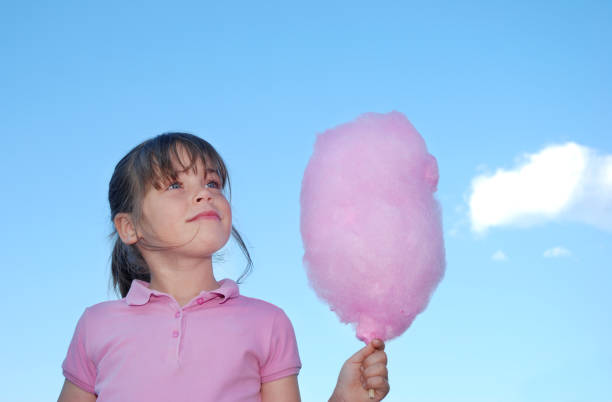Summer Six years old with cotton candy.Best of Being a Kid Lightbox (50 files) child cotton candy stock pictures, royalty-free photos & images