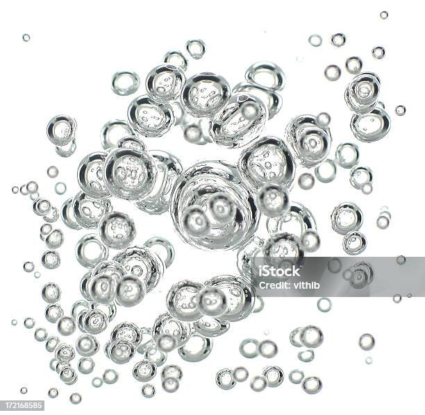 Rising Burbujas Aisladas En Blanco Foto de stock y más banco de imágenes de Abstracto - Abstracto, Actividad, Agua