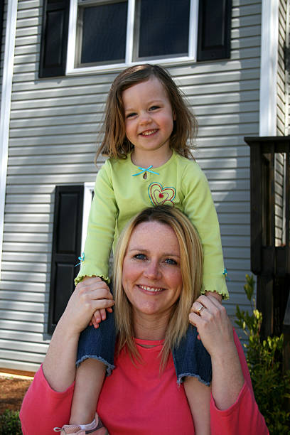 istock Child on Mother's Shoulders 172168601
