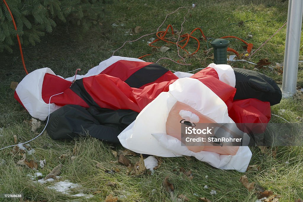 Holiday Fatigue 1, Christmas Stress, Stressed Out Santa Claus Holiday Fatigue. Inflatable Santa Claus with the wind knocked out of him. Might represent stress of the Christmas Season. Santa Claus Stock Photo