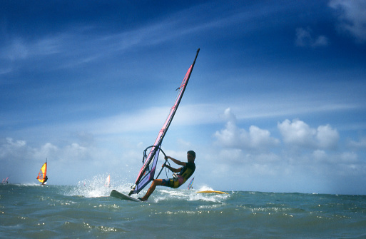 Windsurfers at the shores of Maui. Scan of a colour slide. Film grain visible at full size.