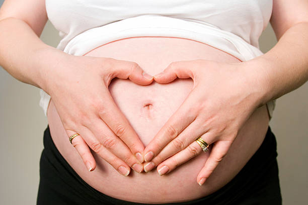 Pregnant woman relaxed in the field