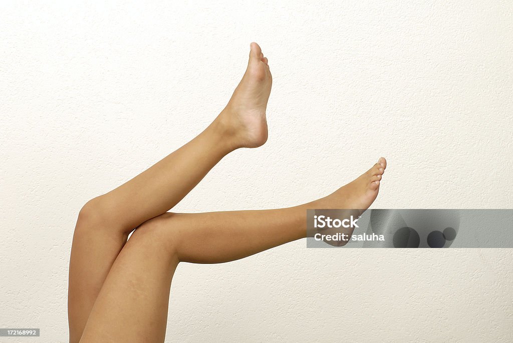 Largo las piernas - Foto de stock de Acostado libre de derechos