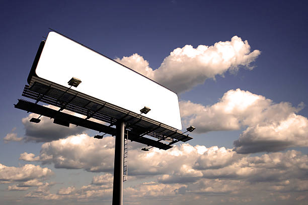 Blank billboard on cloudy sky, just add your text