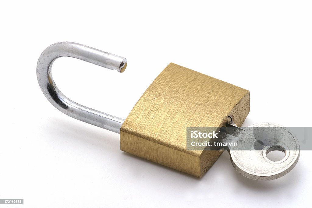 Key to success A small brass padlock with key illustrates the key to unlocking success. Lock Stock Photo
