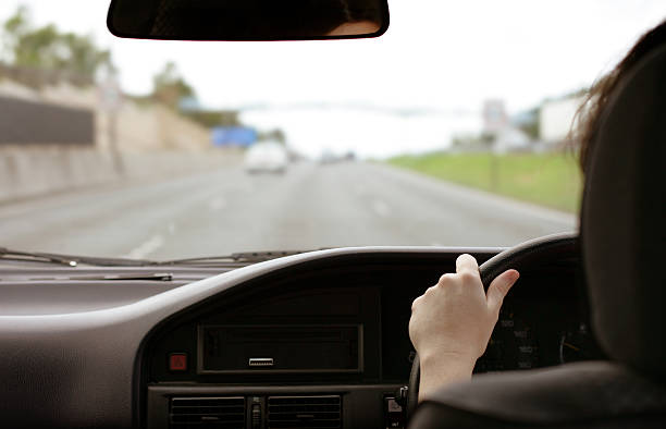 istock A female driving with her hand on the steering wheel 172169776