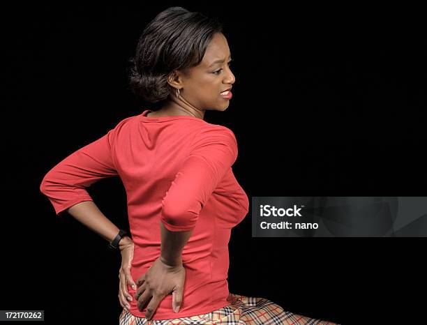 El Dolor De Espalda Foto de stock y más banco de imágenes de Dolor de espalda - Dolor de espalda, Mujeres, Una sola mujer