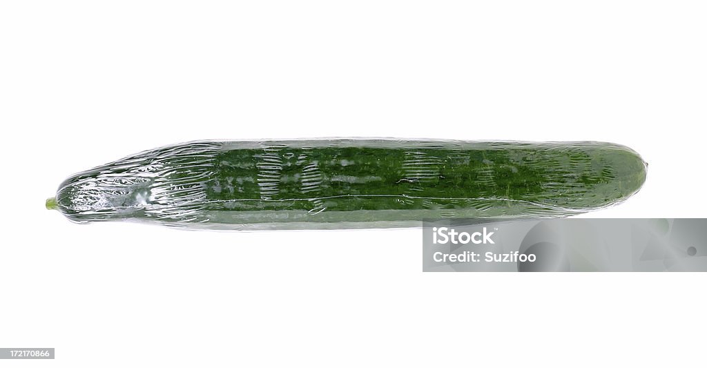 greenhouse cucumber One of those hothouse cucumbers which come shrink-wrapped in plastic. Isolated on white. Cucumber Stock Photo