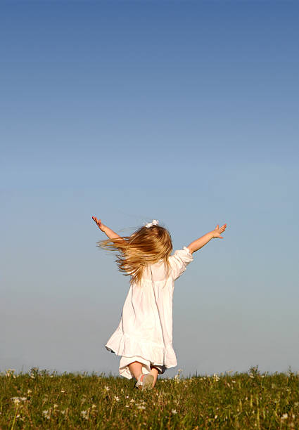 istock Girl running with Open Arms - Clear Blue Sky 172170909