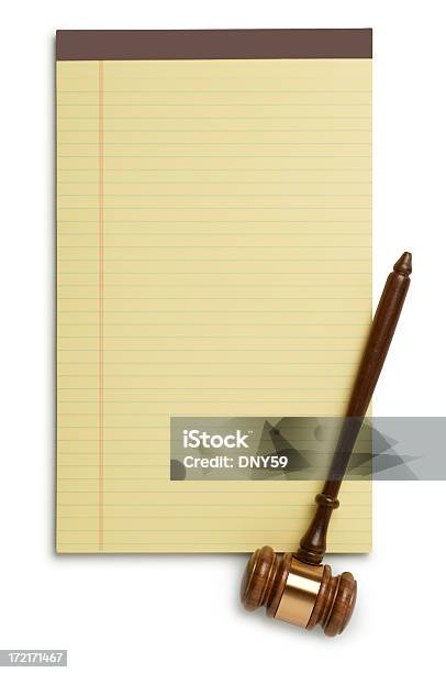 Gavel On Yellow Legal Pad Isolated On White Background Stock Photo - Download Image Now