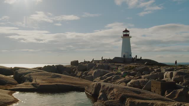 Peggys Cove Lighthouse at sunset in Nova Scotia, Canada.