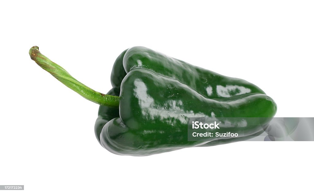 Poblano chile pepper on a white background A fresh poblano chile pepper, isolated on white. Poblano peppers are large and not very hot (relatively speaking) and have thick walls which makes them great for stuffing. Poblano Chili Stock Photo
