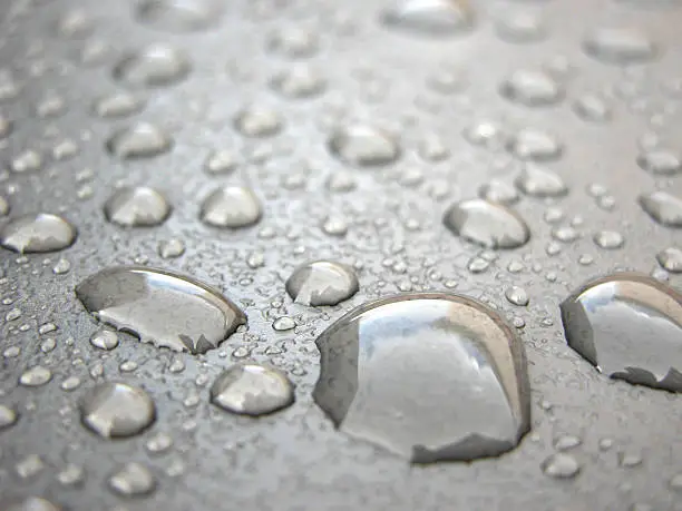 "macro of water drops collecting on a gray plastic background.See more related images in my Textures, Patterns & Backgrounds lightbox:"