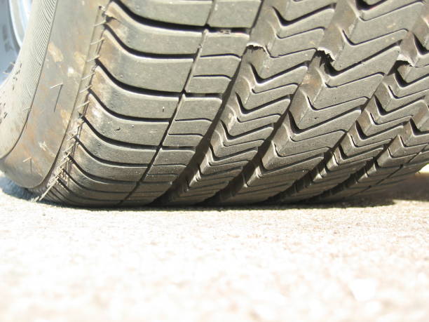 A closeup of a tire on pavement.
