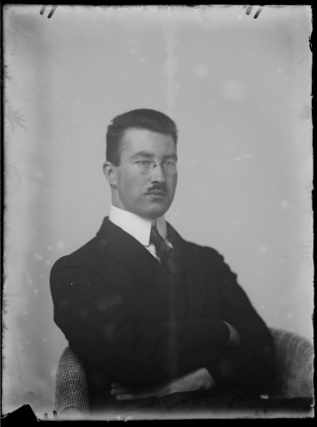 Successful business man of the 1920s looking at the camera.This image is originally a negative on glass. It was digitalized with a Nikon D2X and a macro lens.