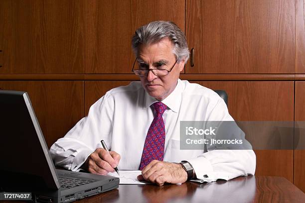 Number Crunching Businessman Stock Photo - Download Image Now - Desk, Adult, Adults Only