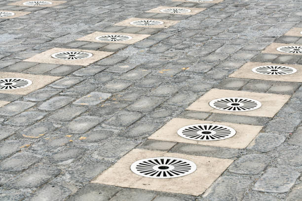 Steel grates cover the street drains.