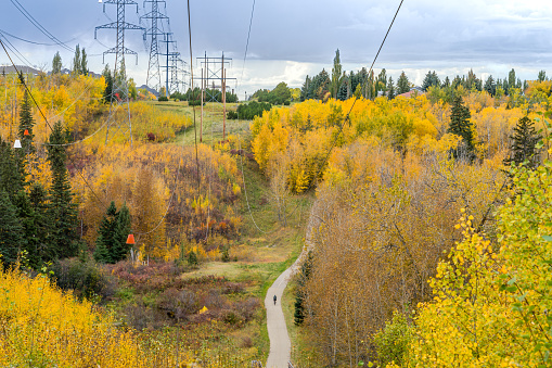 White Mud ravine landscape in fall season with power line corridor and recreation trail