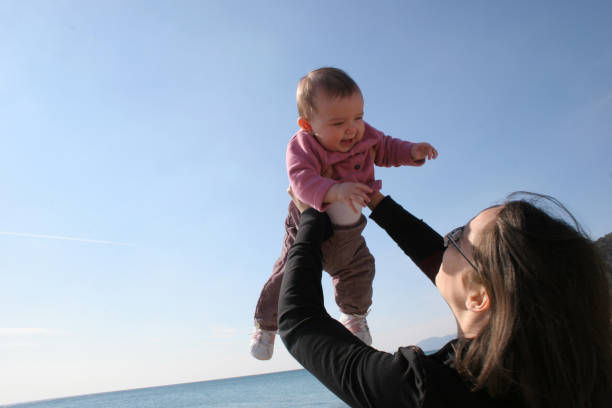 istock mother with daughter in the sky 172174444