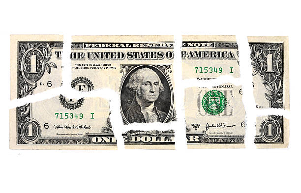 Where does all the money go? $1 bill torn into pieces.  Pieces show torn edges and some shadows.  Where does all your money go  Great to break up for precentages on spending. american one dollar bill photos stock pictures, royalty-free photos & images