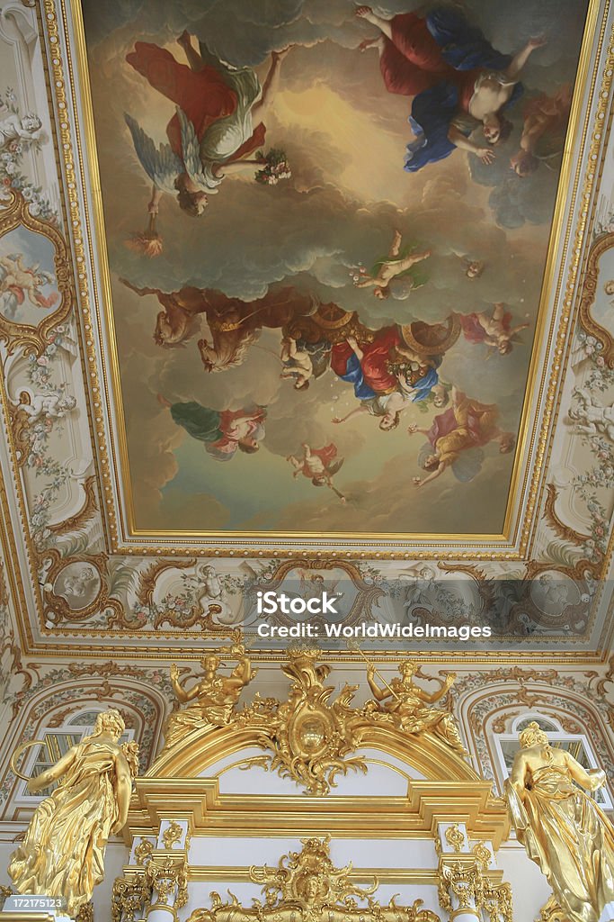 Painted ceiling in Peters Palace,Peterhof, St Petersburg, Russia. "Peters Palace at Peterhof, St Petersburg, Russia.Hundreds of fountains and golden statues surround Peter's Palace- Rusias answer to Versailles.Built between 1709 and 1724 by over 5000 soldiers and slaves was destroyed in WW11 and in the 50's rebuilt from photographs and maps" Abundance Stock Photo