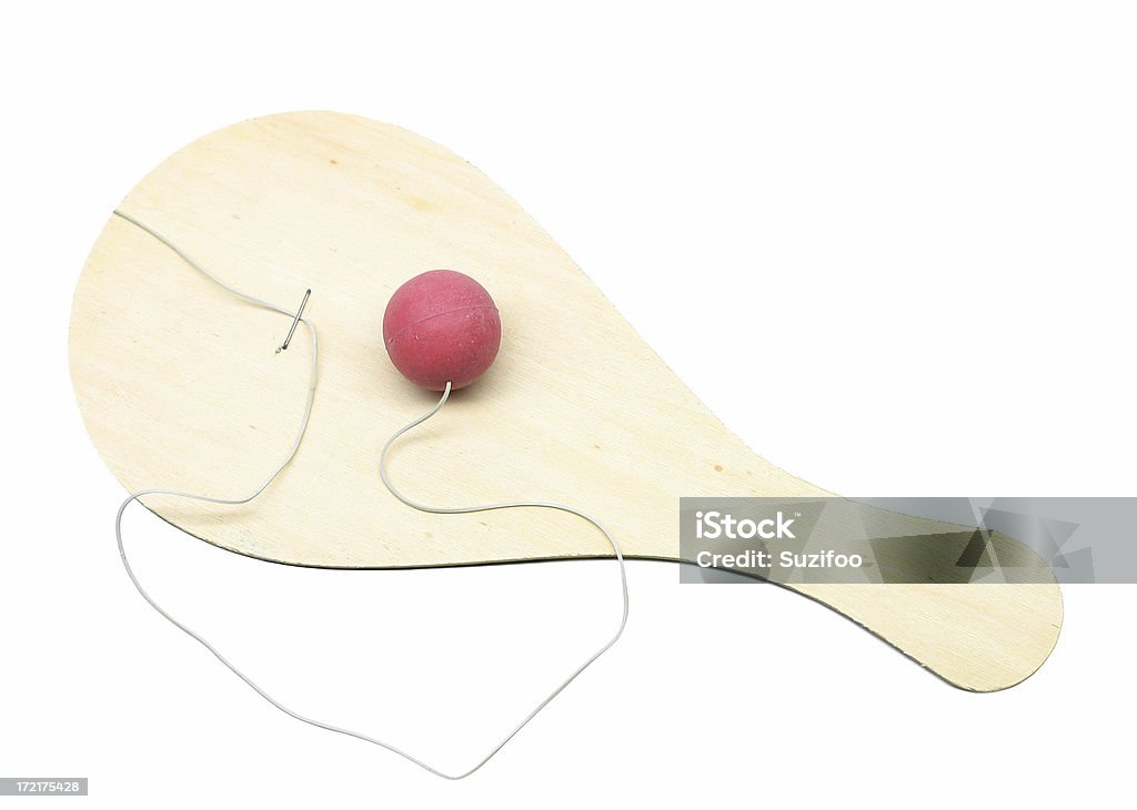 ball and paddle "A classic children's toy, a ball and paddle. Isolated on white." Paddle Ball Stock Photo