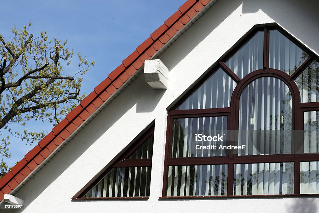 Roof with lavish window Roof with lavish window of family house in suburban surrounding Elegance Stock Photo