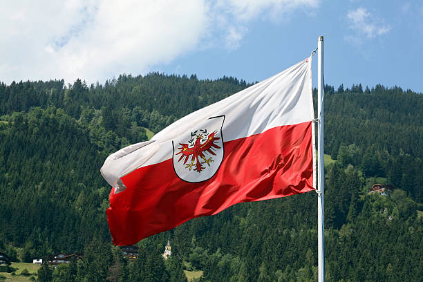 Flag of Tirol  (XL) "Flag of Tirol, Austria with Zillertaler alps in the background. Flag has som motion blurCamera : Canon 5D + 120 mm" zillertaler alps stock pictures, royalty-free photos & images