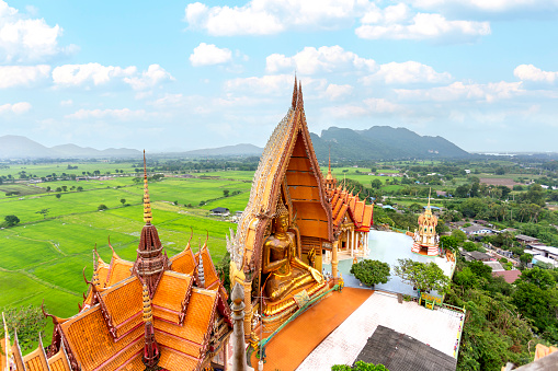 Wat Tham Sua temple at Kanchanaburi province Thailand. Large pagoda and Buddha statue. Beautiful a bigest Buddha statue and it is a major tourist attraction of Thailand.