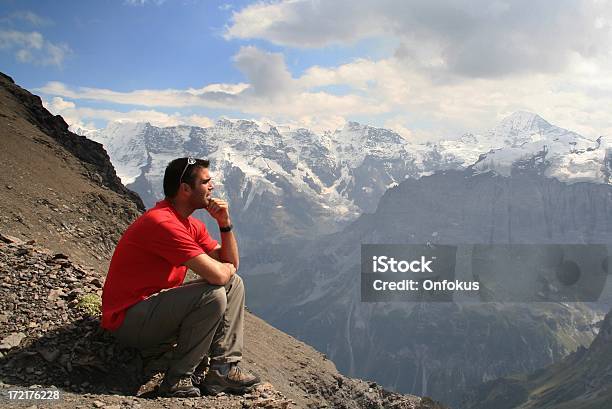 Man Sitting On Top Of Mountain And Thinking Stock Photo - Download Image Now - Activity, Adult, Adults Only