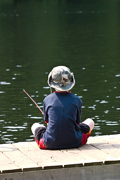 Fishing off the dock stock photo