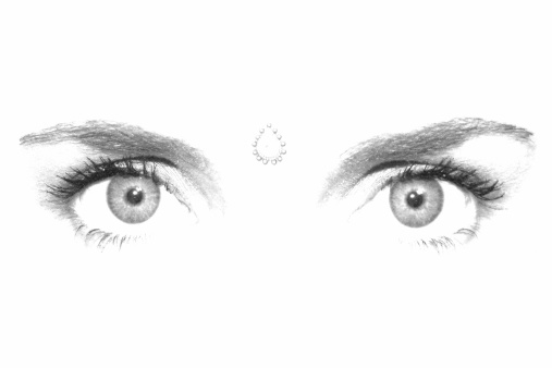 High contrast shot of woman's eyes and bindi (ornamental dot).