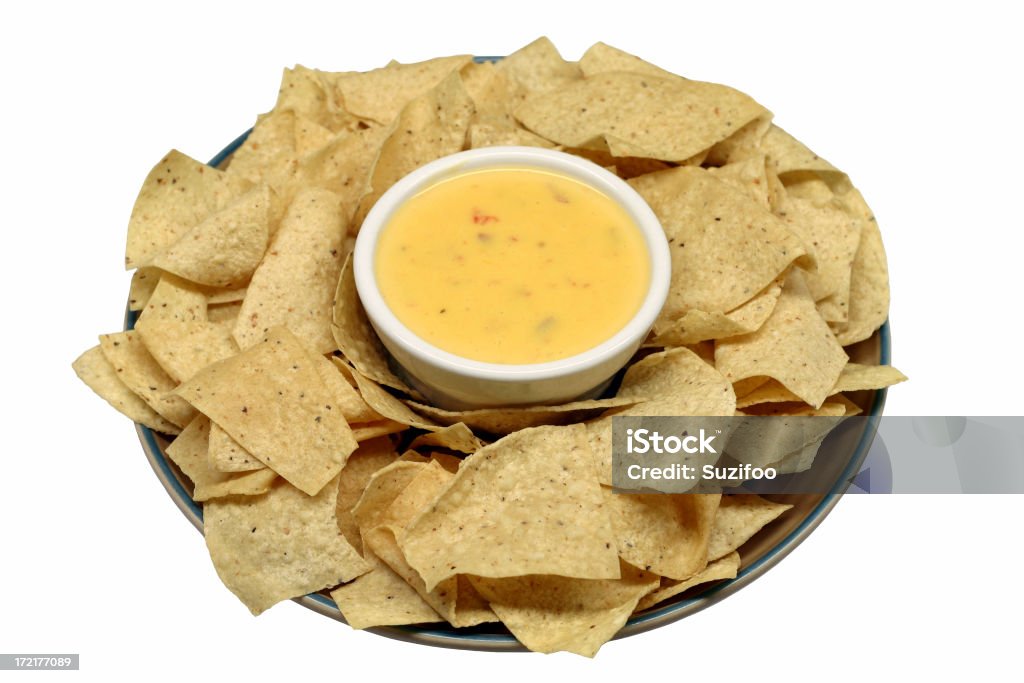 chips and chili con queso "Corn tortilla chips and chili con queso (spicy Mexican melted cheese dip with chile peppers), a classic TexMex appetizer. Isolated on white. I also have another version that has meat in it (link below)." Chile Con Queso Stock Photo