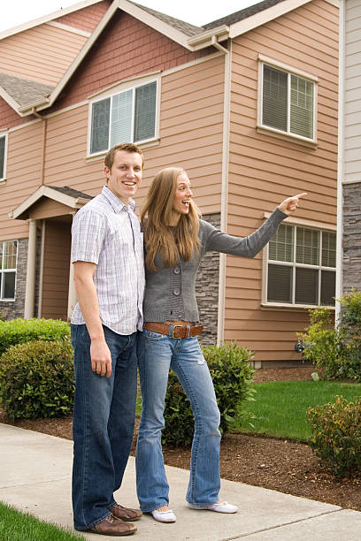 istock cute couple house shopping, man looking at camera 172177294